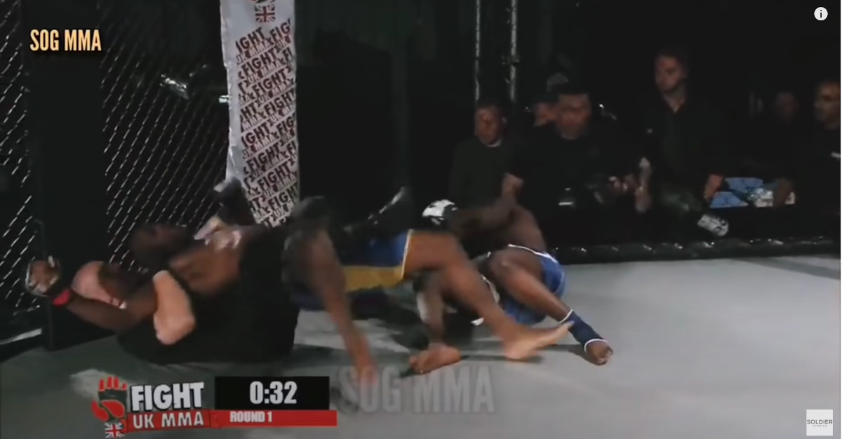 referee block fighter in a match
