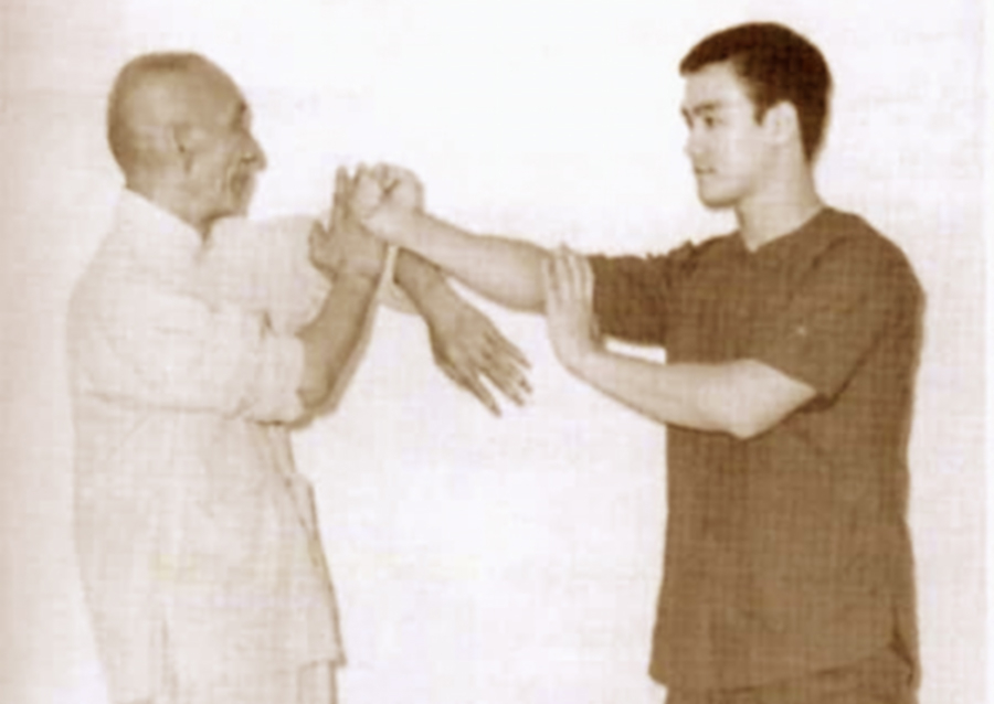 Yip Man and Bruce Lee practicing Lap Sau